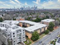 Stunning aerial view of apartment building with the city skyline in the background at 1323 Queens Rd # 424, Charlotte, NC 28207