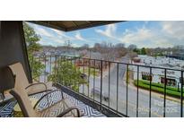 Cozy balcony with outdoor seating offering views of the surrounding neighborhood at 1323 Queens Rd # 424, Charlotte, NC 28207