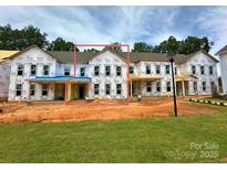 New construction townhomes featuring modern design elements and ample natural light at 274 Gilead Rd, Huntersville, NC 28078