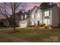 Charming two-story home featuring a well-manicured lawn and a classic architectural design at 910 Elrond Nw Dr, Charlotte, NC 28269