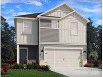 Charming two-story home featuring a two-car garage, neutral siding, and a well-manicured lawn at 5201 Georgette Trl, Cherryville, NC 28021