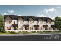 Charming townhome exterior featuring a well-manicured lawn, white picket fence and neutral paint scheme at Lot 7 E Rice St, Landis, NC 28088
