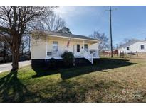 Charming home featuring a welcoming front porch and well-maintained lawn in a residential neighborhood at 206 Mcconnell St, Clover, SC 29710