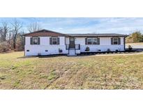 Charming single-story home featuring white painted brick and dark shutters at 2159 Greenleaf Rd, Clover, SC 29710