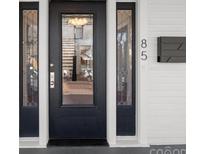 Elegant front door with decorative glass and sidelights enhances curb appeal at 85 Grove Nw Ave, Concord, NC 28025