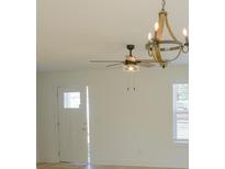 Bright living room featuring decorative lighting, fan, and window at 816 Fairview St # A, Kannapolis, NC 28083