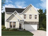 New two-story home with stone accents, attached garage, and manicured lawn at 4027 Vista Pine Dr, Charlotte, NC 28215