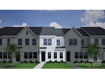 Charming new construction townhome with craftsman-style facade and well-manicured lawn at 4710 Lakeview Rd # Lot 10, Charlotte, NC 28216