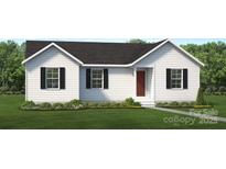 Charming single-story home with white siding, black shutters, and a well-manicured lawn at 703A W Carolina Ave, Bessemer City, NC 28016