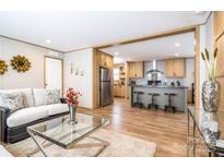 Open-concept living room with modern decor flows into a stylish kitchen with an island and stainless steel appliances at 00 Old York Rd, Chester, SC 29706
