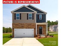 Charming two-story home featuring a brick facade and a two-car garage at 11205 Cardinal Creek Ave, Charlotte, NC 28215