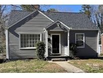 Charming one-story home with gray siding, well-maintained landscaping, and a welcoming front entrance at 618 N Ellis N St, Salisbury, NC 28144