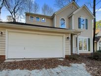 Charming two-story home with a spacious two-car garage and well-maintained tan siding at 4922 Windchase Ln, Charlotte, NC 28269