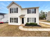 Charming two-story home with white siding, black shutters, and well-maintained landscaping at 1249 Shenandoah Cir, Rock Hill, SC 29730