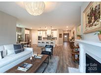 Open concept living area seamlessly blends the living room, kitchen, and dining spaces at 12609 Twilight Dr, Mint Hill, NC 28227