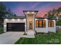 Charming one-story home with a modern design, stylish garage, and inviting front entrance at 17201 Green Hill Rd, Charlotte, NC 28278