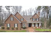 Charming brick home with dark shutters and a welcoming front porch at 720 9Th Nw Ave, Hickory, NC 28601