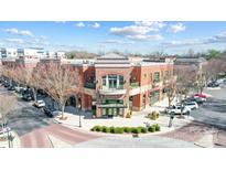 A stately brick exterior building with architectural details and well maintained landscaping, ideal for commercial or residential at 720 Governor Morrison St # 207, Charlotte, NC 28211