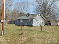 Charming single-story home featuring a well-maintained lawn and traditional architectural details at 915 Chapel St, Landis, NC 28088