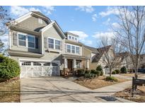 Charming two-story home featuring a craftsman-style facade, stone accents, and a two-car garage at 3004 Fallondale Rd, Waxhaw, NC 28173