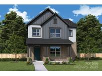 Charming two-story home with a brick facade, covered entry, and a well-maintained front yard at 17017 Malone Ln, Mint Hill, NC 28227