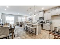 Bright, open-concept kitchen with granite counters, stainless steel appliances, and island seating at 2375 Hedgecliff Rd, Kannapolis, NC 28025