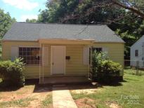 Charming single-story home with a quaint front porch and simple, traditional design at 3405 Rogers St, Charlotte, NC 28208