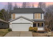 Charming two-story home with a well-maintained lawn, a two-car garage, and beautiful curb appeal at 3230 Richway Ct, Charlotte, NC 28216