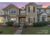 Charming townhouse featuring a well-maintained lawn and welcoming front entrance, creating a cozy curb appeal at 1228 Liberty Bell Ct, Rock Hill, SC 29732