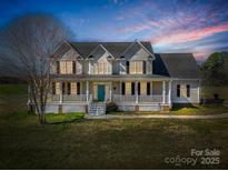 Charming two-story home with a welcoming front porch and well-maintained lawn, perfect for relaxed living at 107 Sunderland Dr, Shelby, NC 28150