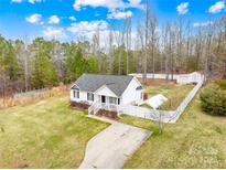 Aerial view of a well-maintained home featuring a spacious yard, driveway, and private backyard at 348 Fleetwood Rd, York, SC 29745