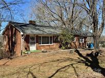Charming brick home featuring a well-maintained yard and classic design elements at 4073 Lee Cline Rd, Conover, NC 28613