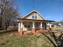 Charming exterior of a well-maintained one-story home featuring a cozy front porch at 1806 Bringle Ferry Rd, Salisbury, NC 28146