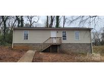 Inviting one-story home with a front entry staircase and neutral siding at 351 Haigler St, Rock Hill, SC 29732