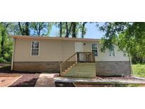 Charming single-story home featuring a new wooden staircase leading to the front entrance and a well-maintained yard at 351 Haigler St, Rock Hill, SC 29732
