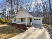 Charming single-story home featuring a welcoming front porch and well-maintained landscaping at 7230 Catawba Springs Rd, Denver, NC 28037