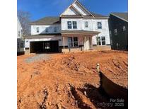 Two-story home features an attached garage, modern window framing, and exterior construction wrapping at 138 Nicholson Ln, Mooresville, NC 28115