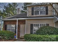 Charming two-story home featuring brick and vinyl siding with well-maintained landscaping at 3258 Summercroft Ln, Charlotte, NC 28269