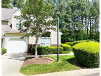 Charming townhome featuring a one-car garage, and well-manicured landscaping at 4580 Antelope Ln, Charlotte, NC 28269