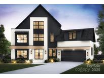 Striking two-story modern home featuring a black and white facade, grand windows and a dark garage door at 910 Laurel Creek Ln, Charlotte, NC 28211