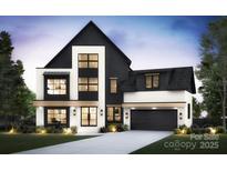 Stunning modern home boasts a striking black and white exterior with large windows and a sleek garage at 910 Laurel Creek Ln, Charlotte, NC 28211