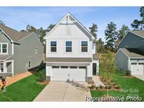 Charming two-story home features a modern facade, well-manicured lawn, and attached garage at 116 Shay Crossing Rd # 2P, Salisbury, NC 28144