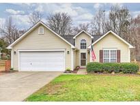Charming home with a well-maintained lawn and attached two-car garage at 2405 Ivy Run Dr, Indian Trail, NC 28079