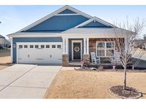 Charming single-story home with stone accents, a two-car garage, and a cozy front porch at 115 E Neel Ranch Rd, Mooresville, NC 28115