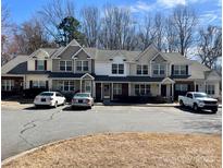 Attractive townhouse complex featuring a well-maintained facade and ample parking at 140 Marakery Rd # C, Mooresville, NC 28115