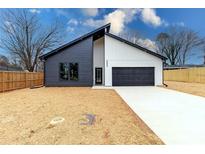 New construction home with a modern design, two-car garage and black and white color scheme at 205 Skyline Cir, Salisbury, NC 28146