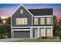 Charming two-story home with gray siding, white trim, covered porch, and an attached garage at 2150 Millennium Dr # 094, Lancaster, SC 29720