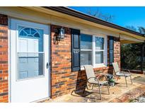 Inviting front porch with seating, perfect for relaxing outdoors at 303 S Eastway Dr, Troutman, NC 28166