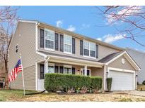 Charming two-story home featuring black shutters, beige siding, and manicured front yard at 733 Rocky Grove Gln, York, SC 29745