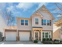 Charming two-story home featuring a two-car garage and a welcoming front entrance at 8028 Tricia Pointe Pl, Indian Land, SC 29707